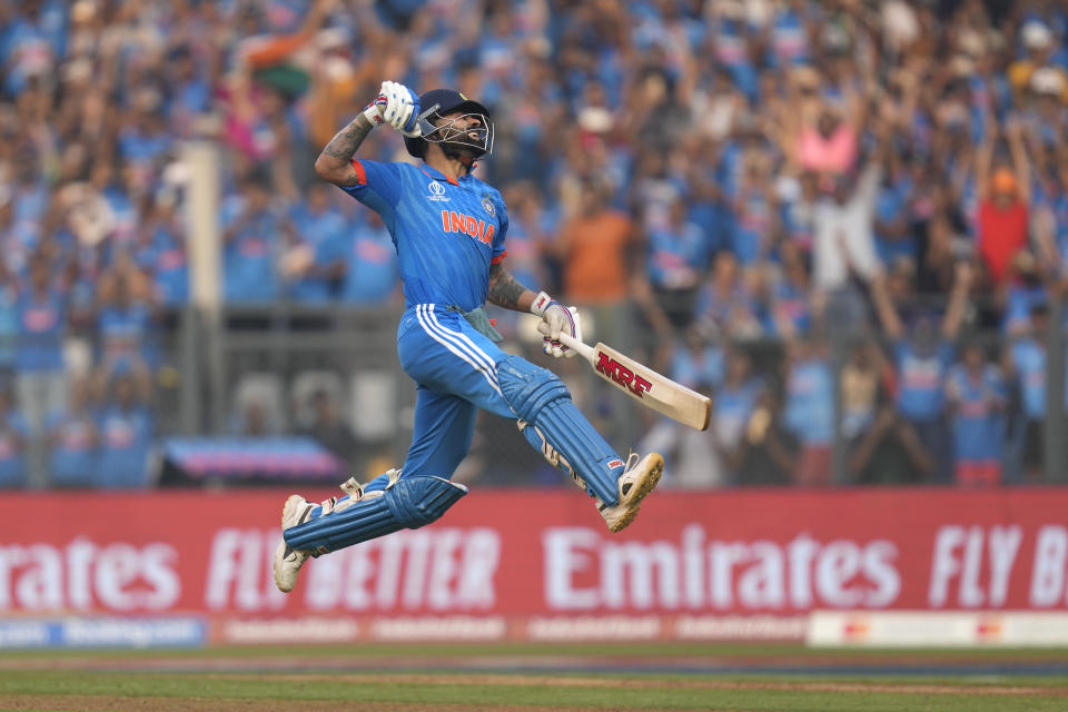 India's Virat Kohli celebrates his century during the ICC Men's Cricket World Cup first semifinal match between India and New Zealand in Mumbai, India, Wednesday, Nov. 15, 2023. Kohli hit his record 50th century in one-day internationals at the Cricket World Cup on Wednesday, surpassing the mark he shared with countryman Sachin Tendulkar. (AP Photo/Rafiq Maqbool)