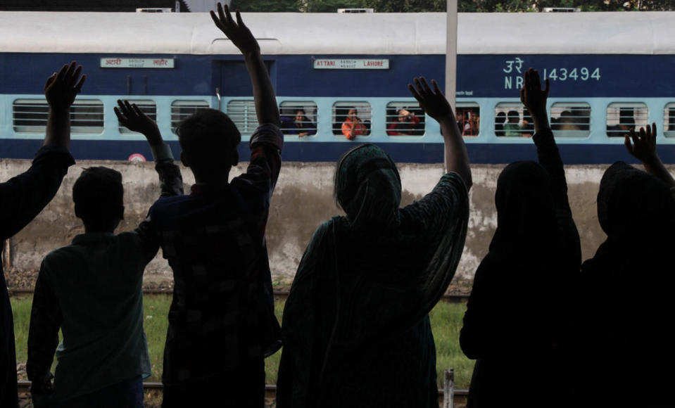 <p>People see off passengers traveling to neighboring India at a railway station in Lahore, Pakistan, Monday, Sept. 26, 2016. The Indian authorities allowed the operation of the Samjhota Express after refusing to permit the train to operate due to a probable security threat. Pakistan and India face tension after an attack earlier this month on an Indian military base in Indian Kashmir that left many soldiers dead. (AP Photo/K.M. Chaudary)</p>