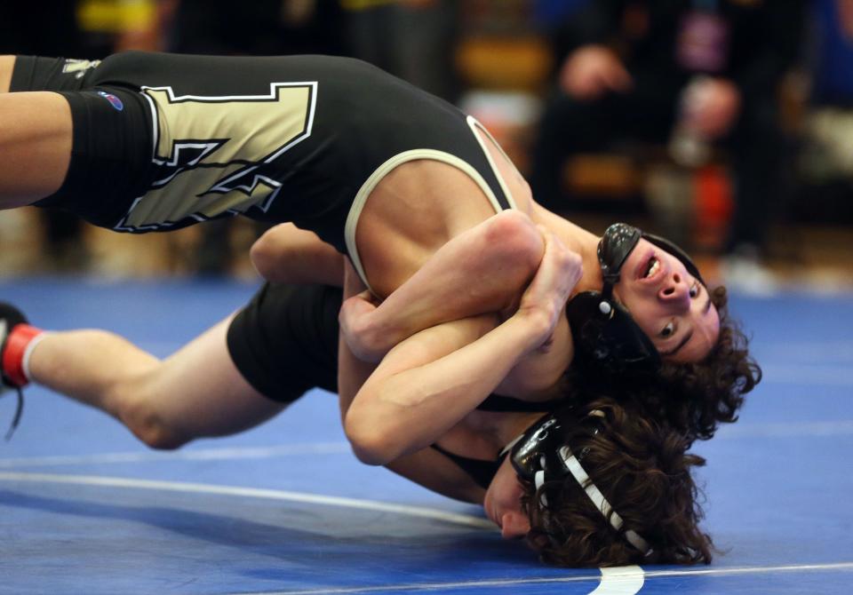 From top, Nanuet's Ethan Badillo on his way to defeating Putnam Valley's Nick Paonessa in the 118-pound weight class during the Section 1 Division II wrestling championships at Hendrick Hudson High School in Montrose Feb. 11, 2023. 