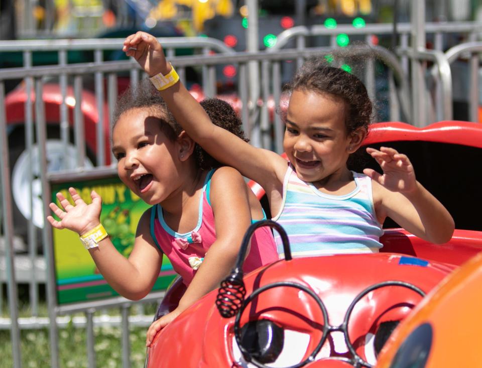 Payton Jones, left, and her sister Olivia Jones ride the Granny Bugs at the Hamburg Family Fun Fest in 2022.