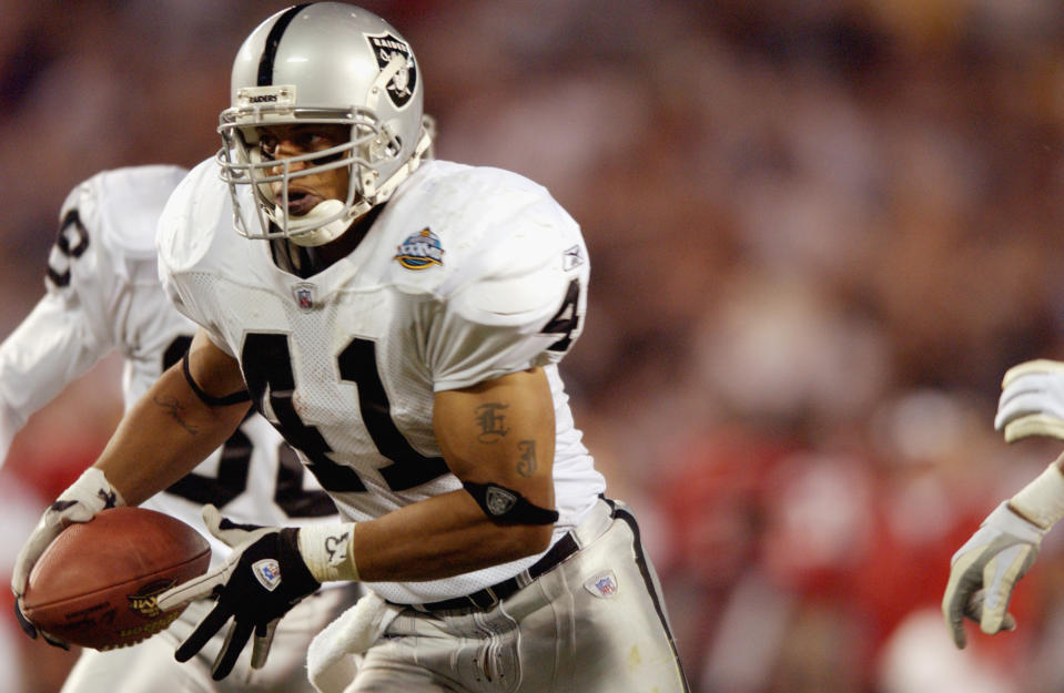 SAN DIEGO - JANUARY 26:  Eric Johnson #41 of the Oakland Raiders returns a blocked punt for a 13 yard touchdown against the Tampa Bay Buccaneers to close the score to 34-15 in favor of the Buccaneers at 14:16 of the fourth quarter in Super Bowl XXXVII on January 26, 2003 at Qualcomm Stadium in San Diego, California.  The Buccaneers defeated the Raiders 48-21.  (Photo by Doug Pensinger/Getty Images)