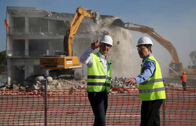 Greek Prime Minister Kyriakos Mitsotakis and Lamda Development CEO Odisseas Athanasiou attend an inaugural ceremony of works at the disused Hellenikon airport in Athens