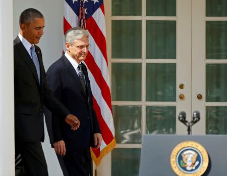 U.S. President Barack Obama (L) walks with Appeals Court Judge Merrick Garland toward a microphone to announce Garland as his nominee to the U.S. Supreme Court in the Rose Garden of the White House in Washington D.C., March 16, 2016. REUTERS/Kevin Lamarque