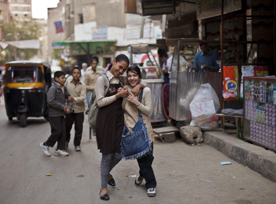 In this Monday, Nov. 26, 2012 photo, Egyptian girls pose for a portrait in the Imbaba neighborhood of Giza, Egypt. Women activists say they won a major step forward with Egypt’s new constitution, which enshrined greater rights for women. But months after its passage, they’re worrying whether those rights will be implemented or will turn out to be merely ink on paper. Men hold an overwhelming lock on decision-making and are doing little to bring equality, activists say, and the increasingly repressive political climate is stifling chances for reforms. (AP Photo/Maya Alleruzzo)