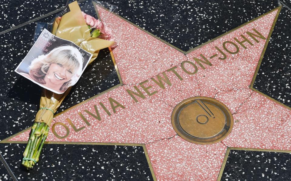 Flowers are placed on Olivia Newton-John's Hollywood Walk of Fame star in California - Rodin Eckenroth/Getty Images