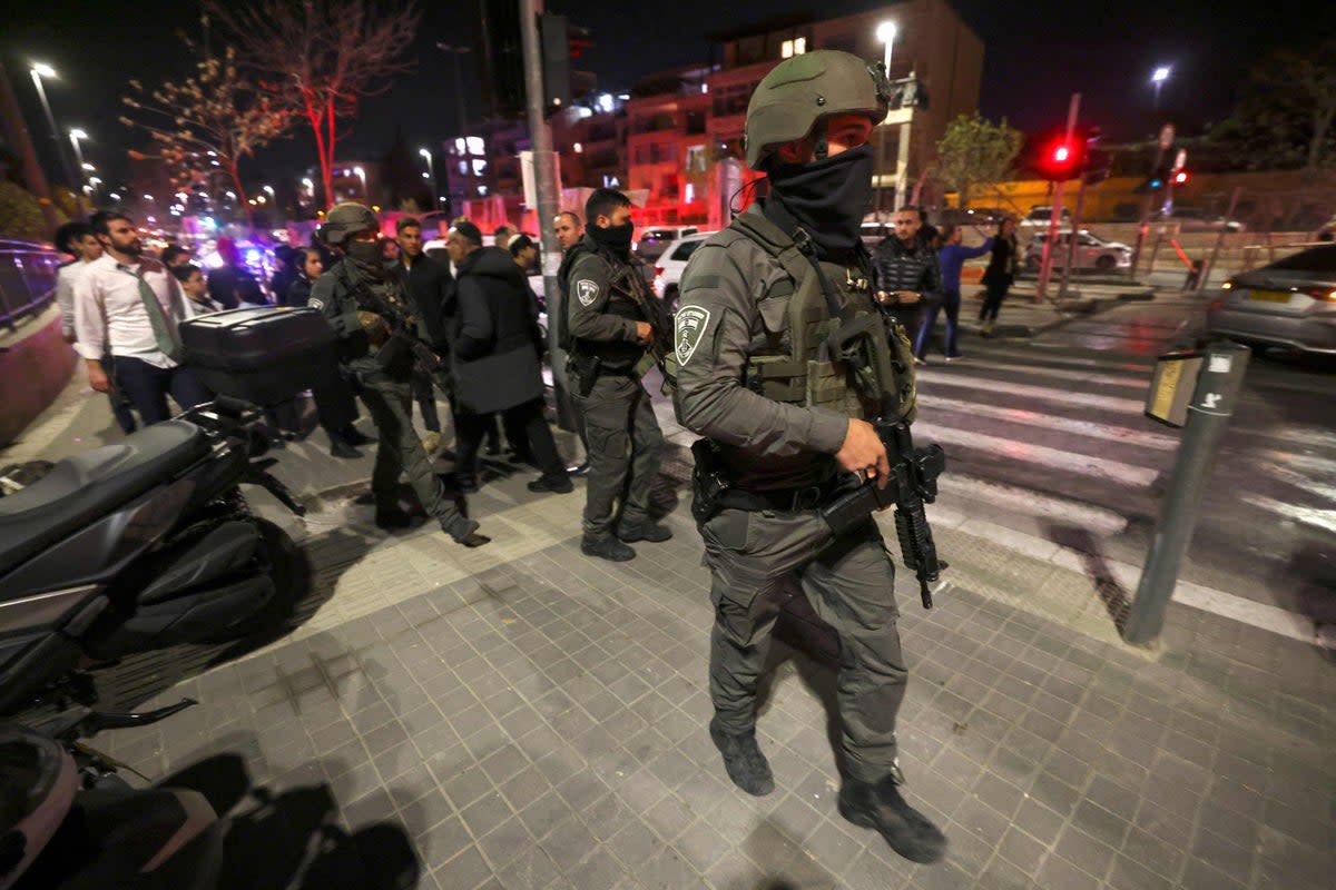 Armed police at the scene of the deadly shooting in Jerusalem  (AFP)