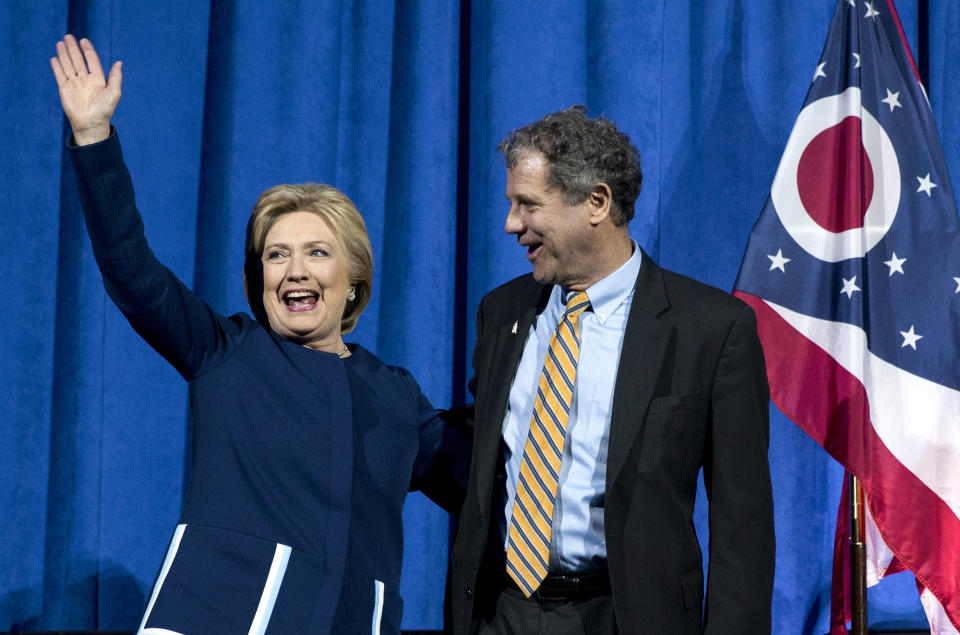 Democratic presidential candidate Hillary Clinton is greeted by Sen. Sherrod Brown as she arrives to speak at the Ohio Democratic Party Legacy Dinner in Columbus. (Photo: Carolyn Kaster/AP)