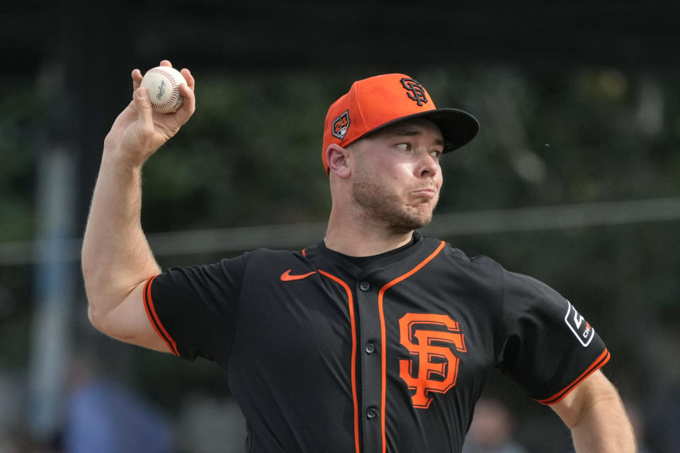 San Francisco Giants pitcher Daulton Jefferies throws against the Seattle Mariners during the fifth inning of a spring training baseball game Tuesday, Feb. 27, 2024, in Scottsdale, Ariz. Jefferies is trying to come back from a second Tommy John surgery at age 28. (AP Photo/Ross D. Franklin)