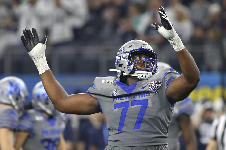 Memphis offensive lineman Obinna Eze (77) celebrates after Memphis kicked a field goal against Penn State in the first half of the NCAA Cotton Bowl college football game, Saturday, Dec. 28, 2019, in Arlington, Texas. (AP Photo/Ron Jenkins)