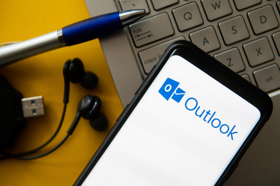 POLAND - 2020/10/20: In this photo illustration a Microsoft Outlook logo seen displayed on a smartphone. (Photo Illustration by Mateusz Slodkowski/SOPA Images/LightRocket via Getty Images)