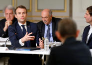 French President Emmanuel Macron gestures as he speaks during a debate with intellectuals at the Elysee Palace in Paris, France March 18, 2019. Michel Euler/Pool via Reuters