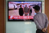 A passer-by watches TV at a railway station in Seoul, showing news coverage of the reported execution of North Korea's defence minister Hyon Yong-Chol, on May 13, 2015