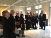 <p>Members of the U.S. and North Korean delegations watch a TV screen showing President Trump meeting North Korean leader Kim Jong Un on Tuesday. (Photo: U.S. Government via Reuters) </p>