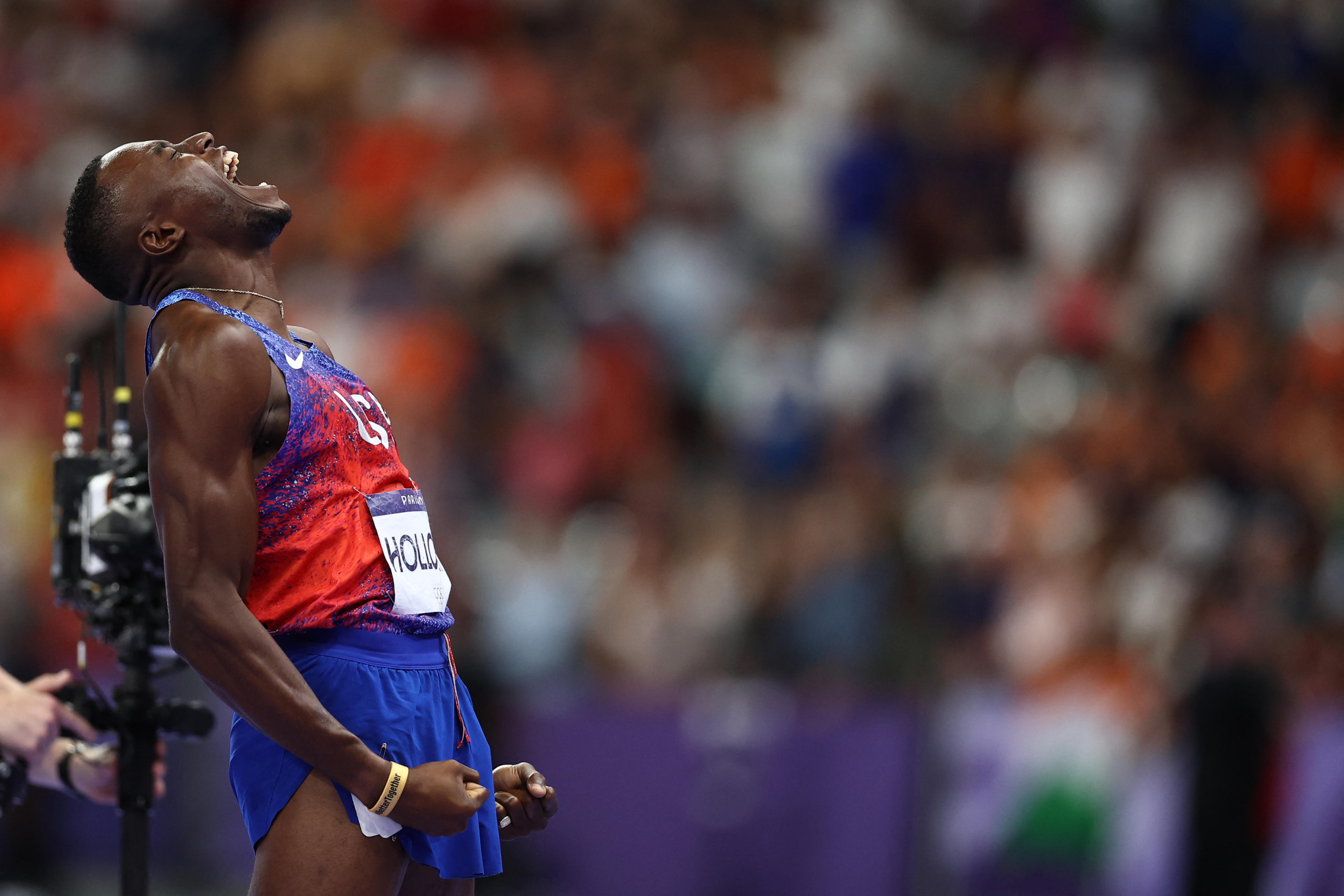 US' Grant Holloway celebrates after winning the men's 110m hurdles final of the athletics event at the Paris 2024 Olympic Games at Stade de France in Saint-Denis, north of Paris, on August 8, 2024. (Anne-Christine Poujoulat/AFP/Getty Images)