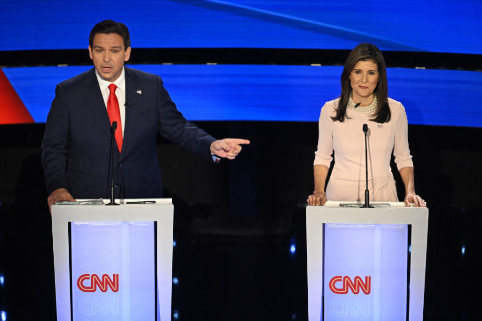 Florida Gov. Ron DeSantis and former U.N. Ambassador Nikki Haley speak during the fifth Republican presidential primary debate at Drake University in Des Moines, Iowa, on Jan. 10, 2024. / Credit: JIM WATSON/AFP via Getty Images