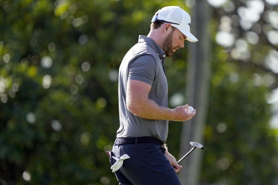 Grayson Murray looks at his ball after his shot on the 14th green during the third round of the Sony Open golf event, Saturday, Jan. 13, 2024, at Waialae Country Club in Honolulu. (AP Photo/Matt York)