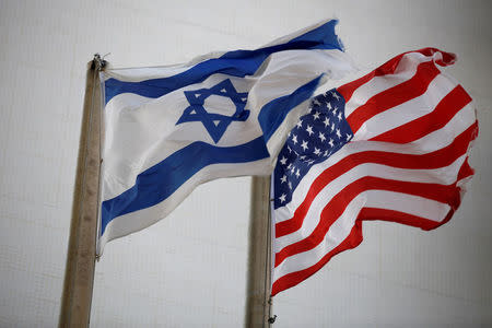 The American and the Israeli national flags can be seen outside the U.S Embassy in Tel Aviv, Israel December 5, 2017. REUTERS/Amir Cohen