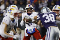 Kansas quarterback Jalon Daniels (6) looks for a receiver during the second quarter of the team's NCAA college football game against Kansas State on Saturday, Nov. 26, 2022, in Manhattan, Kan. (AP Photo/Colin E. Braley)