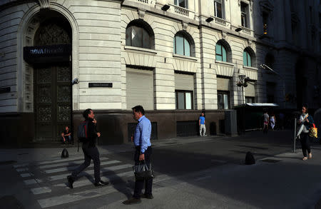 FILE PHOTO: People are pictured outside a bank in Buenos Aires' financial district, Argentina October 18, 2018. Picture taken October 18, 2018. REUTERS/Marcos Brindicci