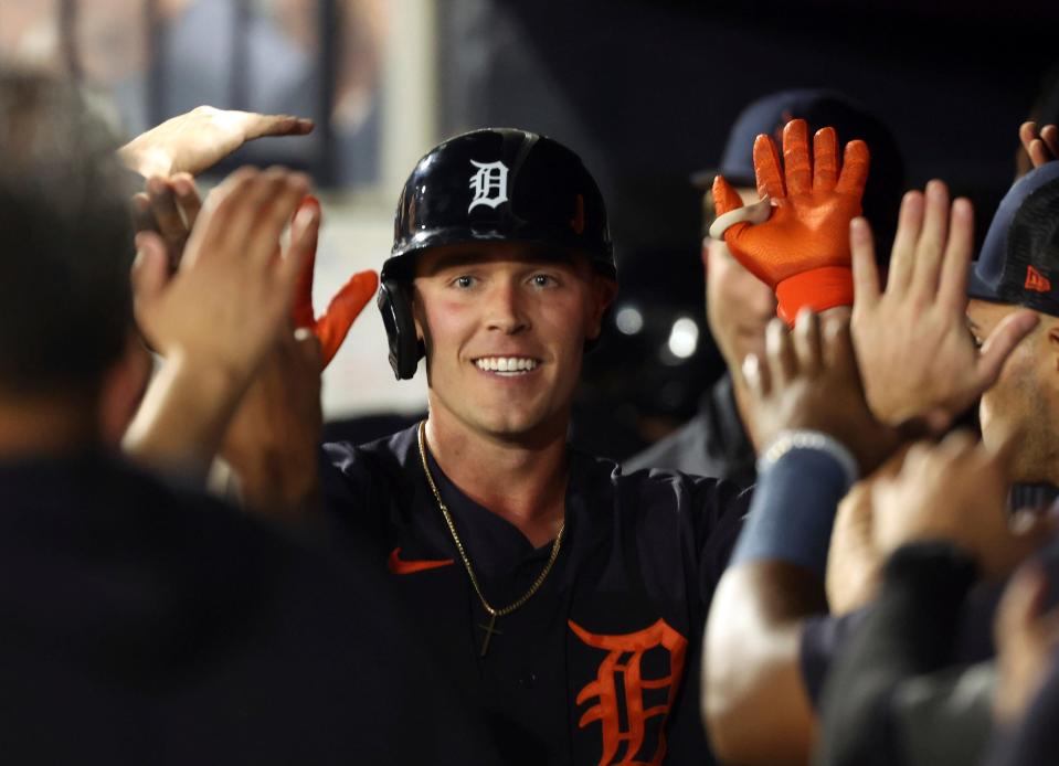 Tigers left fielder Kerry Carpenter is congratulated by teammates  hit a two-run home run during the third inning of the Tigers' 8-5 loss in a spring training game against the Yankees on Monday, Feb. 27, 2023, in Tampa, Florida.