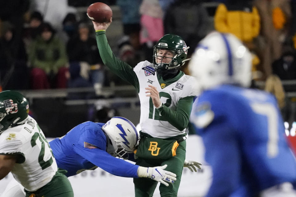Baylor quarterback Blake Shapen (12) throws a pass as Air Force linebacker Bo Richter (8) closes in during the first half of the Armed Forces Bowl NCAA college football game in Fort Worth, Texas, Thursday, Dec. 22, 2022. (AP Photo/LM Otero)