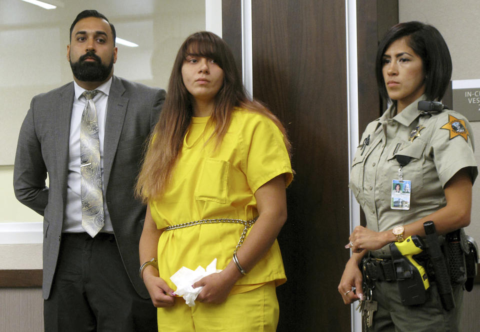 In this July 28, 2017 file photo, Obdulia Sanchez (centre) appears in a Los Banos branch of the Merced County Superior Court, in California, with her public defender, Ramnik Samrao, left. On the right is a police officer. Sanchez was sentenced to six years and four months in prison for driving drunk while livestreaming the crash that killed her younger sister. 