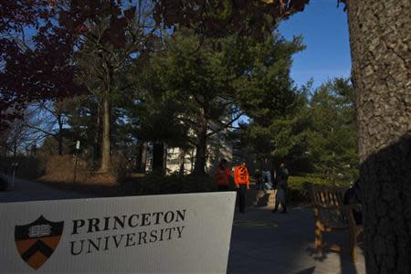 People walk around the Princeton University campus in New Jersey, November 16, 2013. REUTERS/Eduardo Munoz