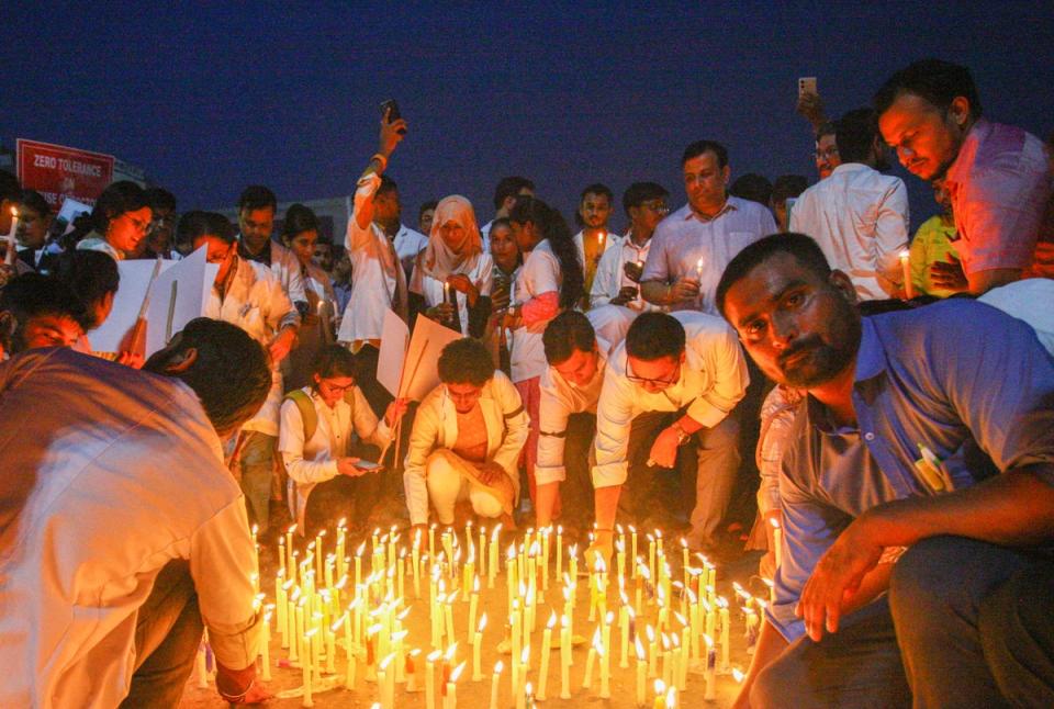 Senior and resident doctors take part in a candlelight march during a protest and nationwide strike against the rape and murder of the woman doctor (Getty Images)