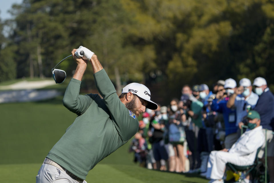 Dustin Johnson hits his tee shot on the first hole during a practice round for the Masters golf tournament on Monday, April 5, 2021, in Augusta, Ga. (AP Photo/David J. Phillip)