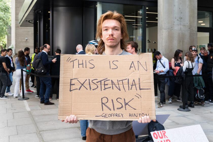 LONDON, UNITED KINGDOM - MAY 24, 2023: Demonstrators gather outside UCL's Logan Hall to protest against OpenAI's aim to develop Artificial General Inteligence (AGI) in London, United Kingdom on May 24, 2023. The protest coincides with a visit by OpenAI's CEO Sam Altman for a panel discussion at UCL. (Photo credit should read Wiktor Szymanowicz/Future Publishing via Getty Images)