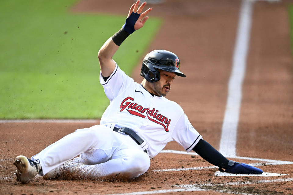 Cleveland Guardians' Steven Kwan scores on a sacrifice fly hit by José Ramírez during the first inning of a baseball game against the Detroit Tigers, Tuesday, May 9, 2023, in Cleveland. (AP Photo/Nick Cammett)