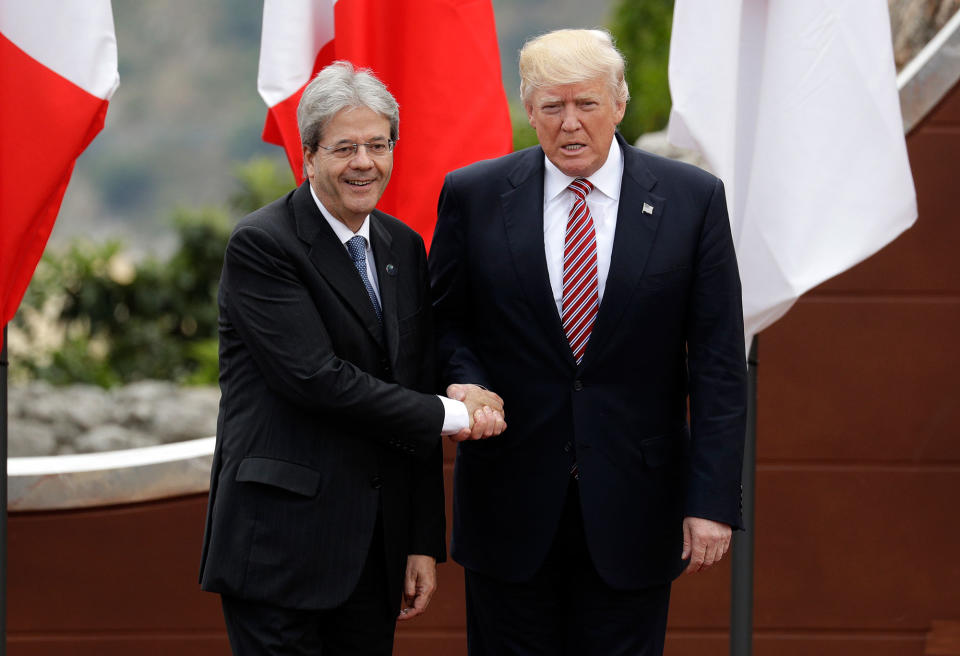 <p>Italian Prime Minister Paolo Gentiloni, left, welcomes President Donald J. Trump prior to a group photo during a G7 Summit in the Ancient Theatre of Taormina ( 3rd century BC) in the Sicilian citadel of Taormina, Italy, Friday, May 26, 2017. (Photo: Andrew Medichin/AP) </p>