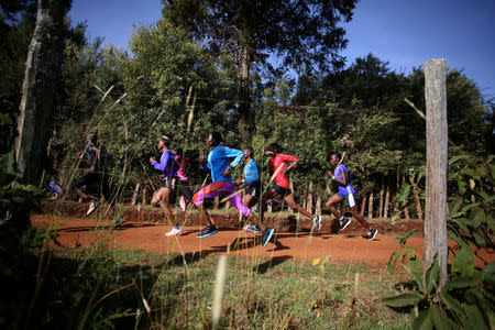 Athletes exercise in the early morning in Iten, near the town of Eldoret, western Kenya, March 21, 2016. REUTERS/Siegfried Modola