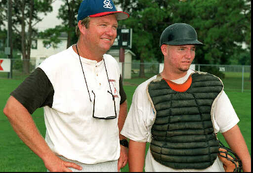 Clyde Metcalf with his son Mike as the prepare for the Babe Ruth World Series in 1996. Herald-Tribune/File photo