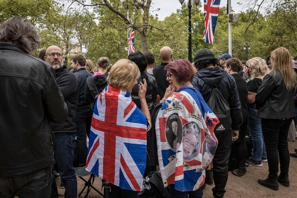 Crowds gather on The Mall near Buckingham Palace to watch the funeral of Queen Elizabeth II on September 19, 2022 in London, England. Elizabeth Alexandra Mary Windsor was born in Bruton Street, Mayfair, London on 21 April 1926. She married Prince Philip in 1947 and ascended the throne of the United Kingdom and Commonwealth on 6 February 1952 after the death of her Father, King George VI. Queen Elizabeth II died at Balmoral Castle in Scotland on September 8, 2022, and is succeeded by her eldest son, King Charles III.