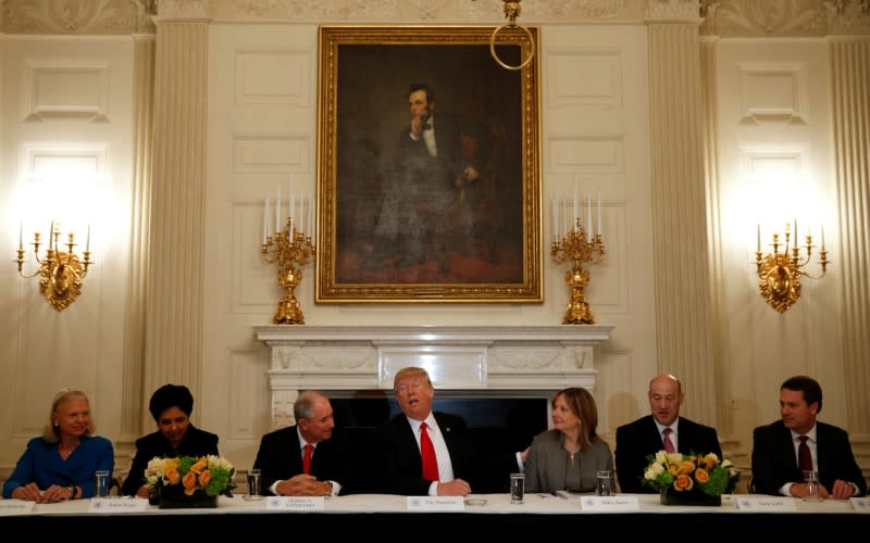 U.S. President Donald Trump puts his hand on General Motors CEO Mary Barra while hosting a strategy and policy forum with chief executives of major U.S. companies at the White House in Washington, U.S. February 3, 2017. From L-R are IBM CEO Ginni Rometty, Pepsico CEO Indra Nooyi, Blackstone CEO Stephen Schwarzman, U.S. President Donald Trump, General Motors CEO Mary Barra, White House National Economic Council Director Gary Cohn and Wal-Mart CEO Doug McMillon. REUTERS/Kevin Lamarque      TPX IMAGES OF THE DAY - RTX2ZIOT