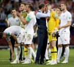 <p>England head coach Gareth Southgate embraces Jordan Pickford at the end of the match </p>