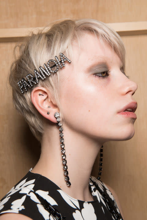 <p>Not just for the office Christmas do, jewelled hair clips are<em> the</em> acccessory du jour. </p><p>Do as Ashley Williams AW17 did by wearing one statement clip to the side or fully embrace the trend Toga AW17 style by fixing multiple mismatched jewels all over. </p><p>Beauty shoot stylist to the stars Ben Cooke says, 'If you're going to try the multi-jewelled hair clip trend, you need a good amount of texture in your hair so they don't slip and slide and fall out.</p><p>This is better done on hair that's slightly dirty. Add some dry shampoo at the root, then randomly tong your mid lengths and a few ends to create the texture. </p><p>Then, using your fingers, roughly mess it up. Quickly your hair pull up into a loose ponytail and half pull it through to achieve a messy bun. Then place your clips wherever you like, just remember you don't need to see them all when you look front on in the mirror.'</p><p><strong>ELLE Loves...</strong><a rel="nofollow noopener" href="https://www.amazon.co.uk/Aussie-Miracle-Instant-Shampoo-Normal/dp/B00V9ZVKHW" target="_blank" data-ylk="slk:Aussie Miracle Mega Instant Dry Shampoo, £4.73;elm:context_link;itc:0;sec:content-canvas" class="link ">Aussie Miracle Mega Instant Dry Shampoo, £4.73</a></p>