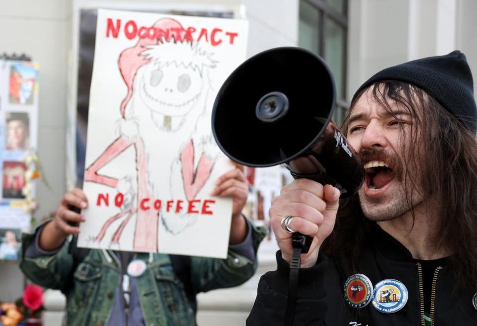 <div class="inline-image__caption"><p>A striking Starbucks worker outside of a Starbucks coffee shop during a national strike on November 17 in San Francisco, California. </p></div> <div class="inline-image__credit">Justin Sullivan</div>