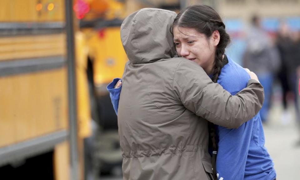 Gabriela Mauricio, right, a 14-year-old freshman, hugs her mother, Meche Mauricio, outside Waukesha South high school.