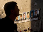 FILE PHOTO - A man mourns inside the Beslan school gymnasium September 1, 2009. REUTERS/Stringer/File Photo