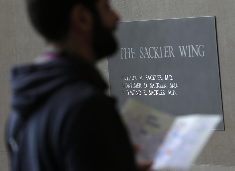 A sign with some names of the Sackler family is displayed at the Metropolitan Museum of Art in New York, Thursday, Jan. 17, 2019. (AP Photo/Seth Wenig)