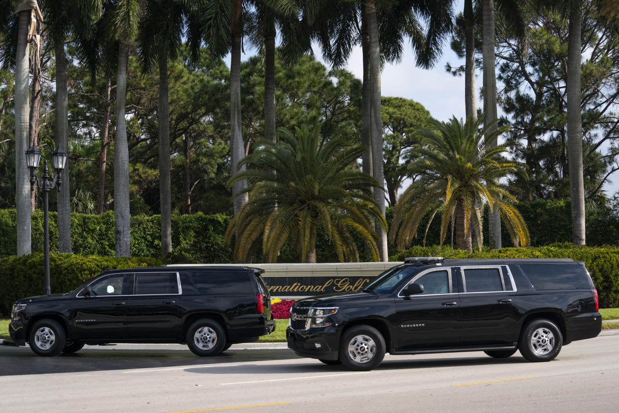 A motorcade carrying former President Donald Trump arrives at Trump International Golf Club, Sunday, April 2, 2023, in West Palm Beach, Fla. (AP Photo/Evan Vucci)