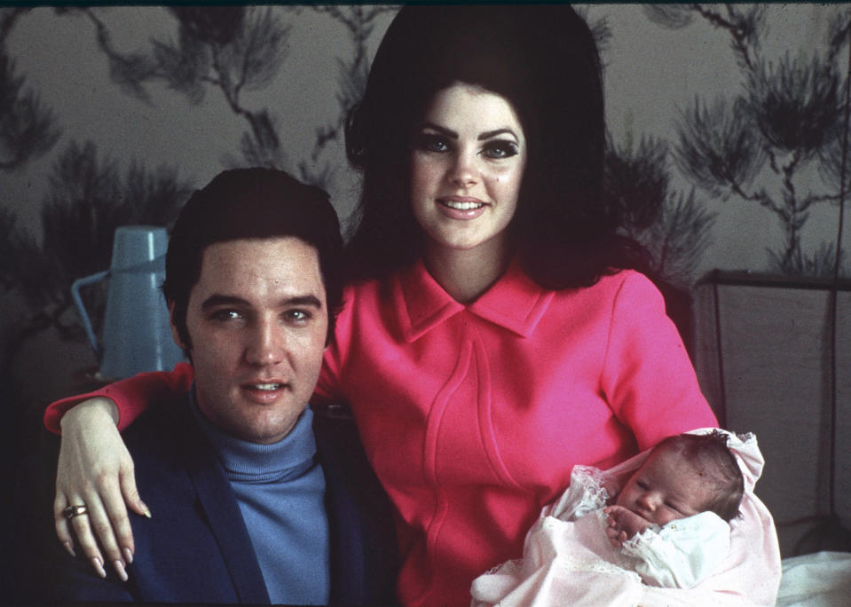 FILE -Elvis Presley poses with wife Priscilla and daughter Lisa Marie, in a room at Baptist hospital in Memphis, Tenn., on Feb. 5, 1968. Lisa Marie Presley, a singer, Elvis’ only daughter and a dedicated keeper of her father’s legacy, died Thursday, Jan. 12, 2023 after being hospitalized for a medical emergency. (AP Photo/File)