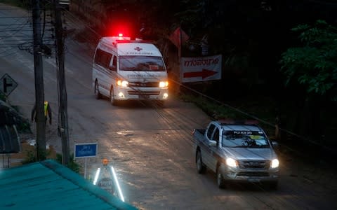 One of two ambulances seen leaving the cave in northern Thailand after the rescue operation began - Credit: Sakchai Lalit/AP