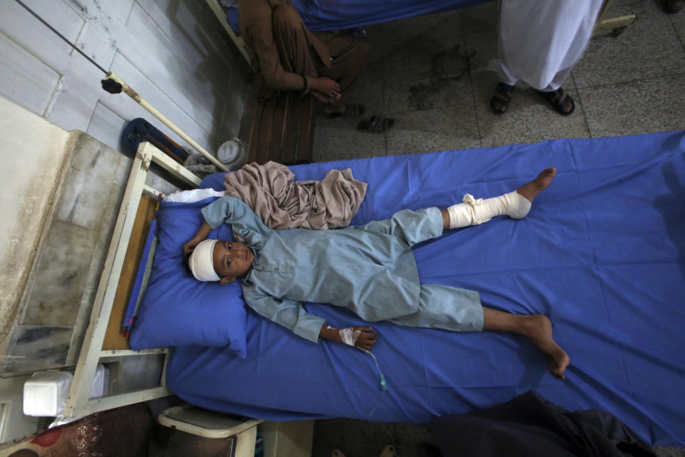 An Injured boy lies on the bed at a hospital after Sunday's suicide bomber attack, in the Bajur district of Khyber Pakhtunkhwa, Pakistan, Monday, July 31, 2023. Pakistan held funerals on Monday for victims of a massive suicide bombing that targeted a rally of a pro-Taliban cleric the previous day. (AP Photo/Mohammad Sajjad)