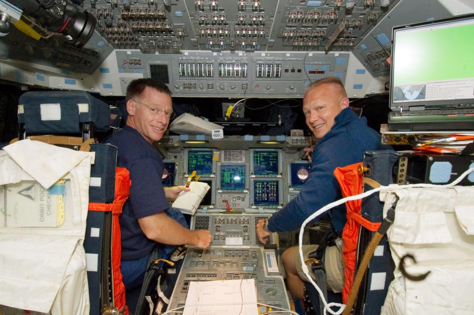 IN SPACE - JULY 9:  In this handout image provided by the National Aeronautics and Space Administration (NASA), NASA astronauts Chris Ferguson (L) and Doug Hurley are pictured at the commander's station and pilot's station, respectively, on the flight deck of the Earth-orbiting NASA space shuttle Atlantis on the second day of activity July 09, 2011 in space. Atlantis has embarked on a 12-day mission to the International Space Station where it will deliver the Raffaello multi-purpose logistics module packed with supplies and spare parts. This will be the final launch of the space shuttle program, which began on April 12, 1981 with the launch of Colombia.  (Photo by NASA via Getty Images)