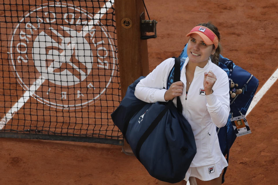 Sofia Kenin of the U.S. celebrates winning her quarterfinal match of the French Open tennis tournament against Danielle Collins of the U.S. in three sets 6-4, 4-6, 6-0, at the Roland Garros stadium in Paris, France, Wednesday, Oct. 7, 2020. (AP Photo/Alessandra Tarantino)