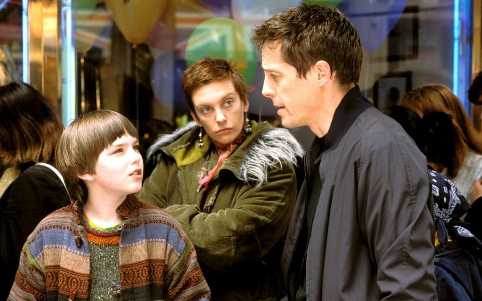 Nicholas Hoult with Toni Collette and Hugh Grant in About a Boy (2002) - Credit: Rex