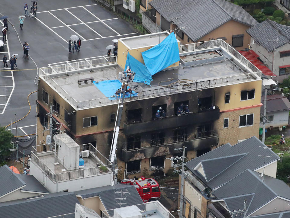This aerial view shows the rescue and recover scene after a fire at an animation company building killed some two dozen people in Kyoto on July 18, 2019. - At least 24 people were feared dead in a suspected arson attack on the animation company in the Japanese city of Kyoto on July 18, a fire department official told AFP. (Photo by JIJI PRESS / JIJI PRESS / AFP) / Japan OUT        (Photo credit should read JIJI PRESS/AFP/Getty Images)
